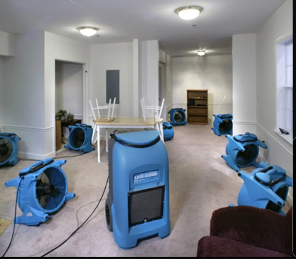 Air movers and dehumidifier setup for Water Damage Restoration in Southold